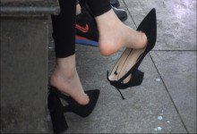 Woman with child and phone is dangling